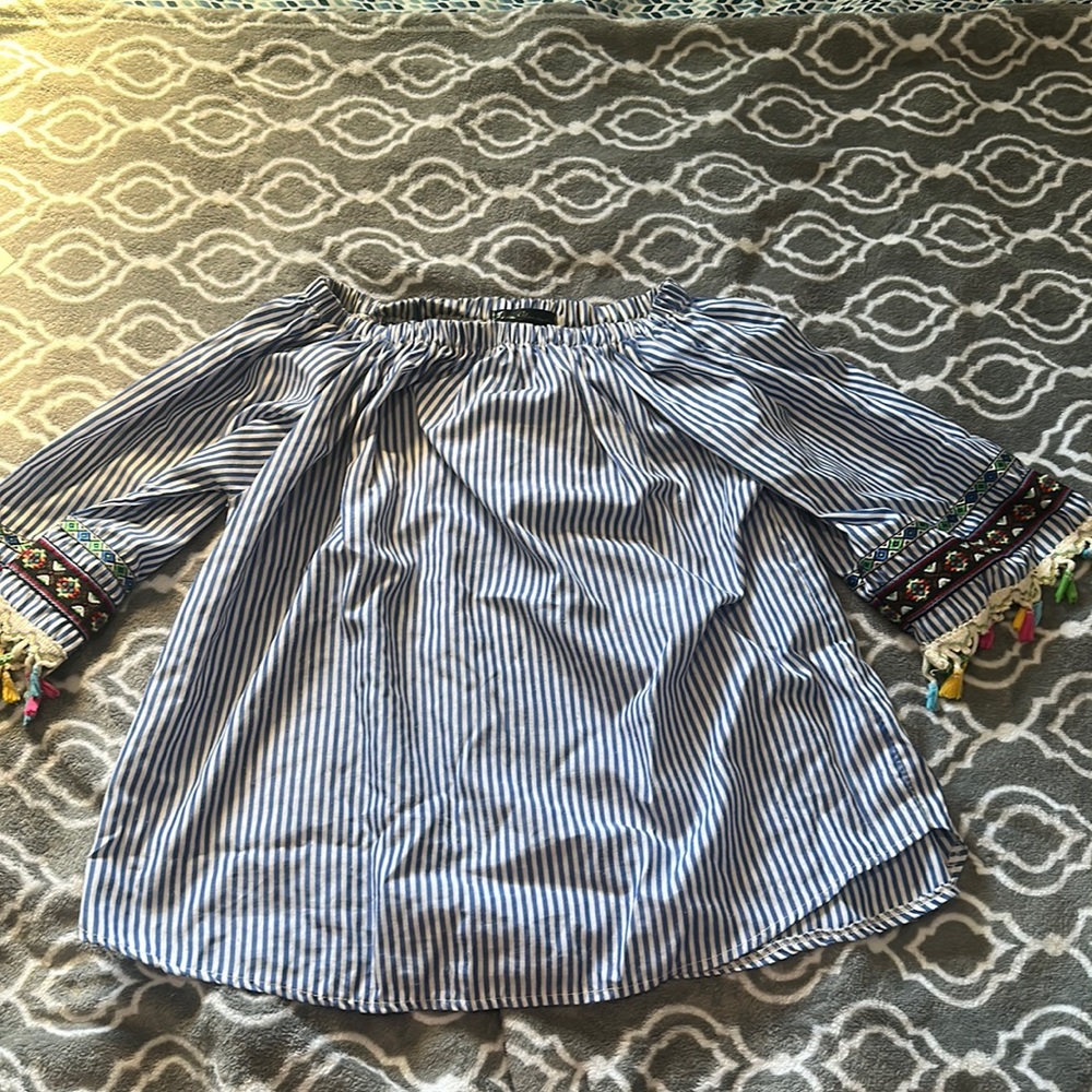 Off the should shirt with tassels
